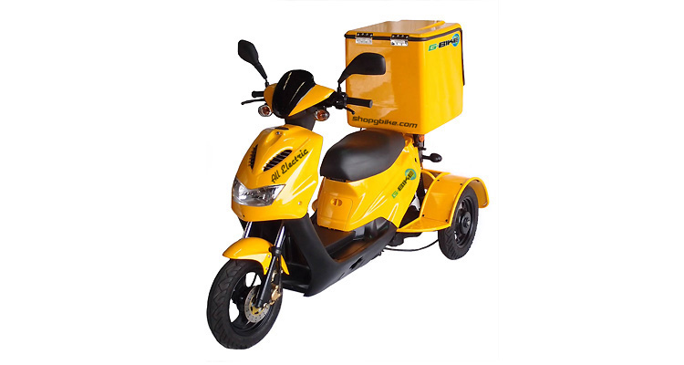 Angle shot of yellow commercial delivery trike